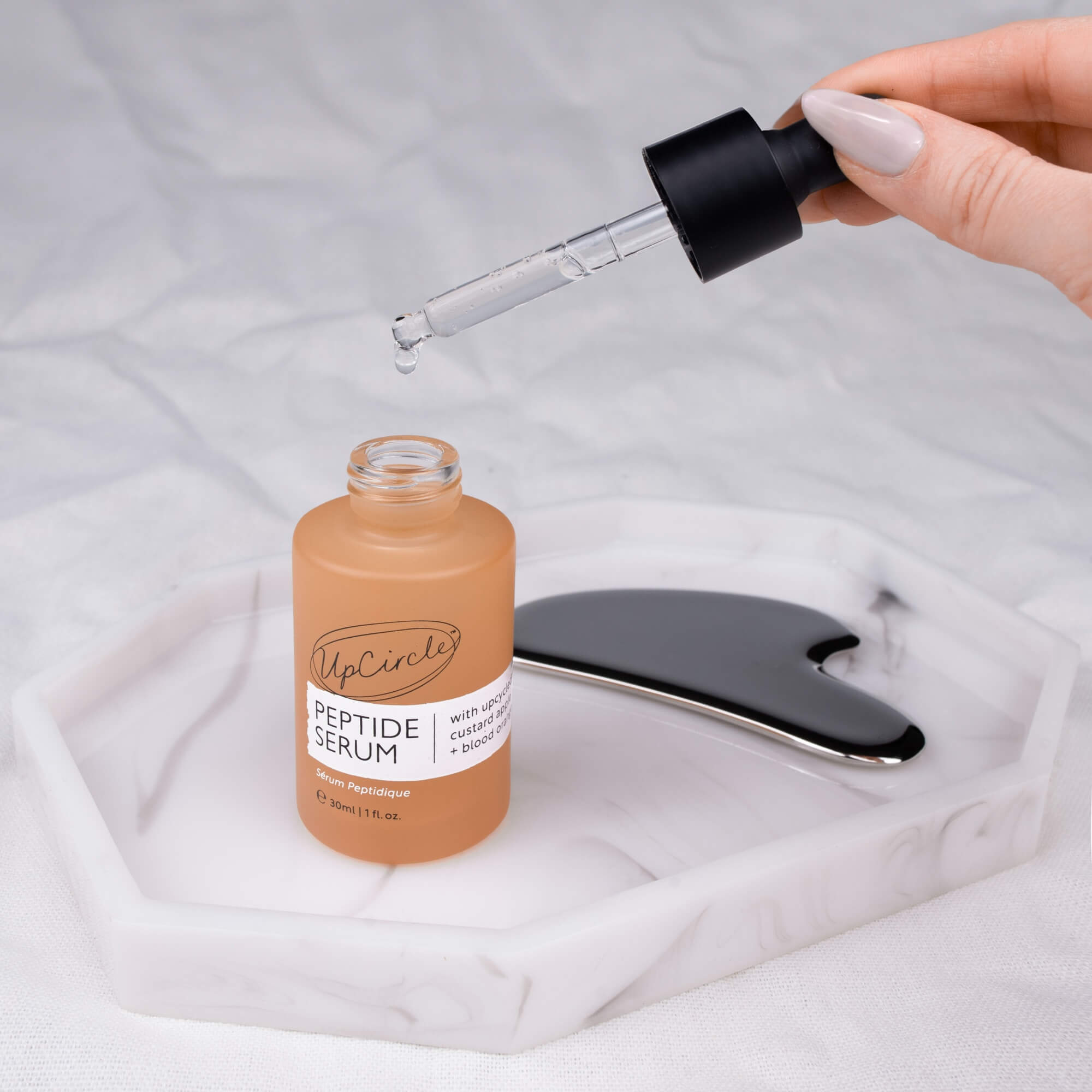 Peptide serum with upcycled custard apple and blood orange